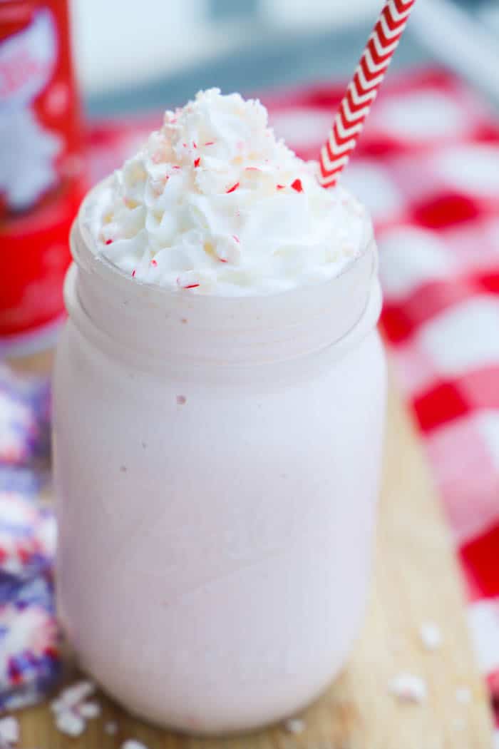 Peppermint Milkshake in a mason jar with a red straw