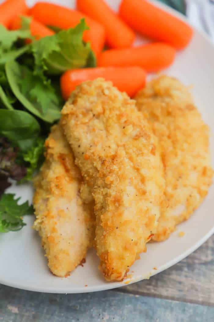 Ritz Chicken Tenders on a plate with salad 