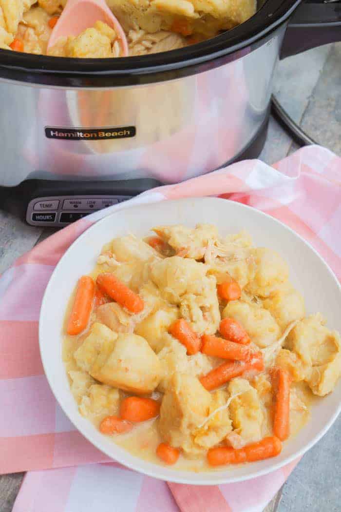 Slow Cooker Chicken and Dumplings in a white bowl