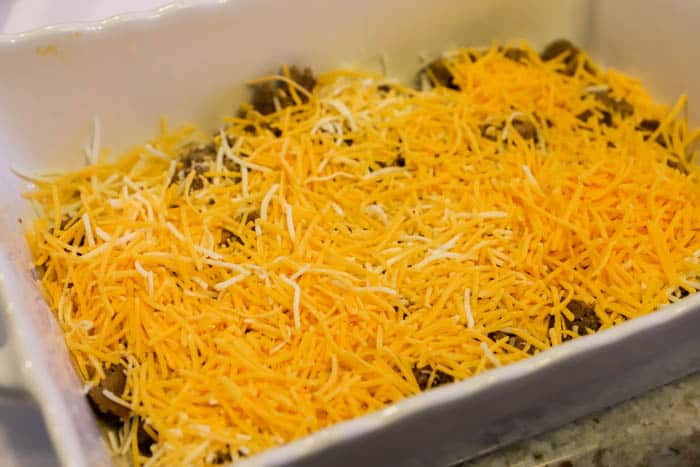 shredded cheese added to the casserole dish