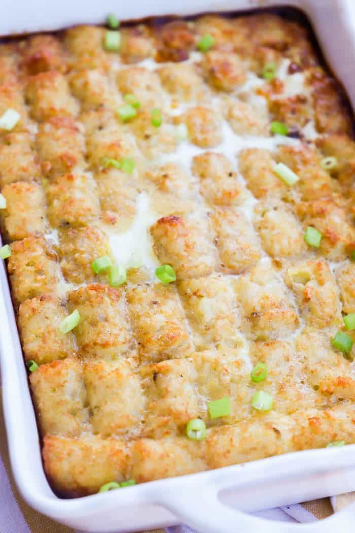 Tater Tot Breakfast Casserole served in a white casserole dish