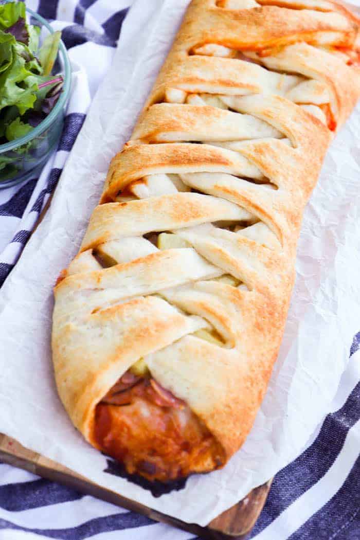 Hawaiian Pizza Braid on a cutting board