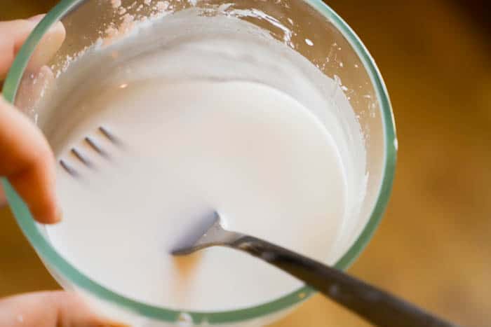 mixing water and cornstarch in a bowl