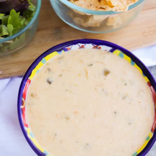 Slow Cooker Queso Dip in a colorful bowl