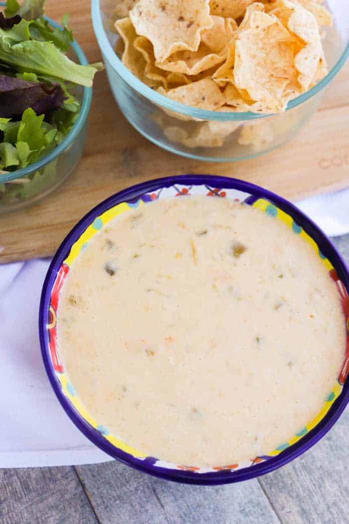 Slow Cooker Queso Dip in a colorful bowl