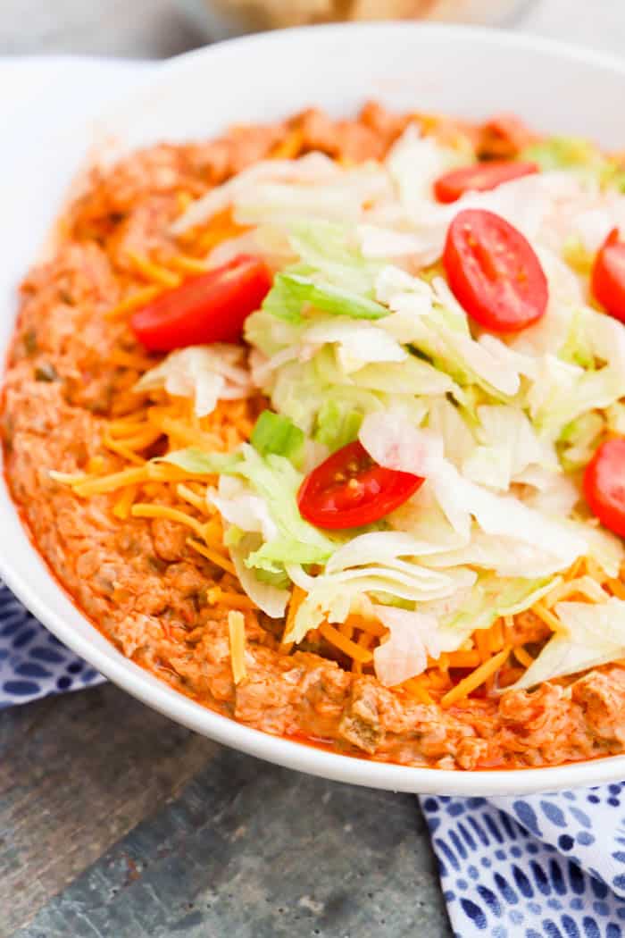  Taco Dip topped with lettuce and tomatoes