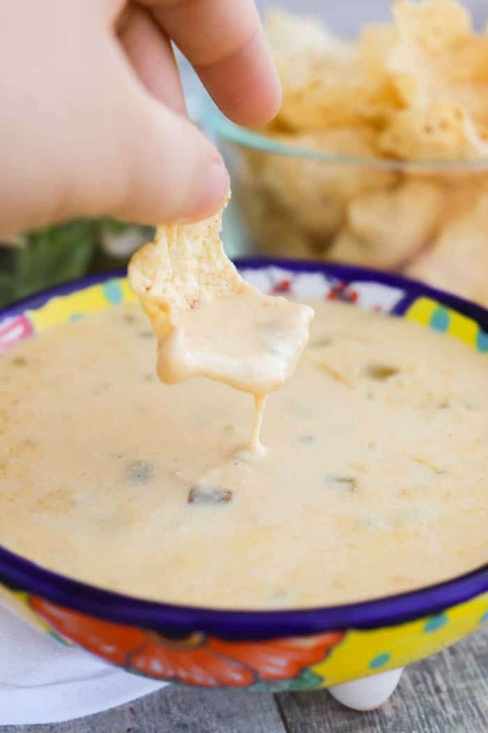 Slow Cooker Queso Dip with a chip