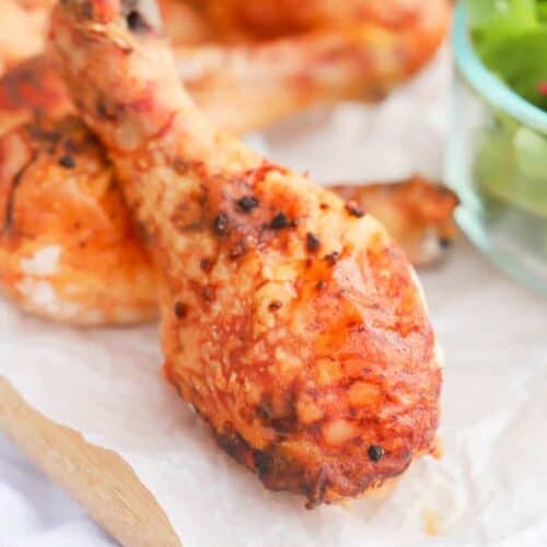 Baked Honey Garlic Chicken Legs on a cutting board