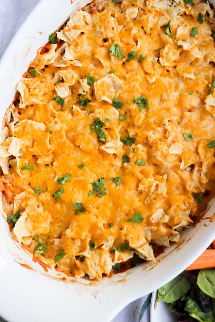 Chicken Taco Casserole in a white casserole dish