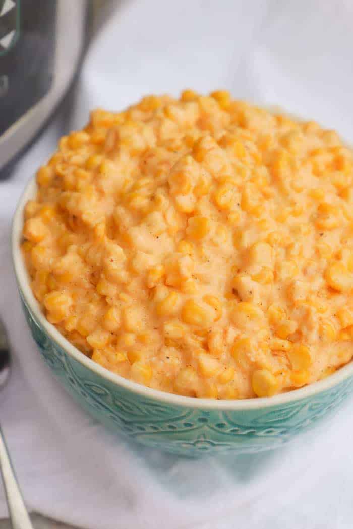 Slow Cooker Cheesy Creamed Corn in a blue bowl