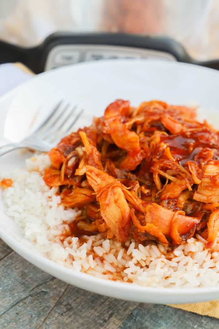 Slow Cooker Orange Chicken over rice in a bowl