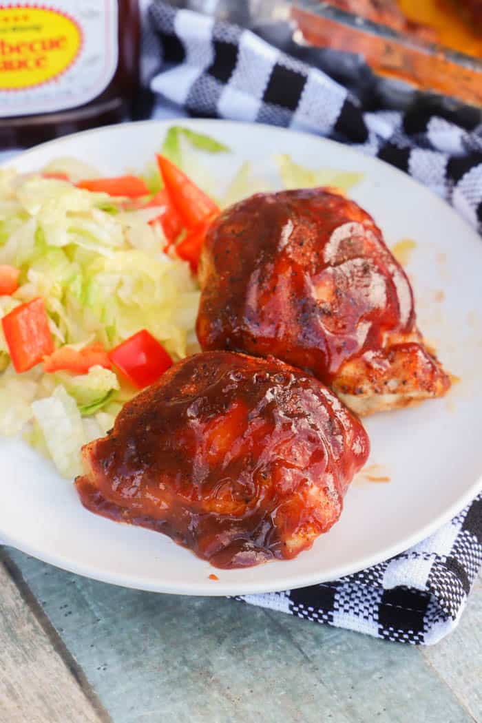 Baked BBQ Chicken Thighs on a white plate