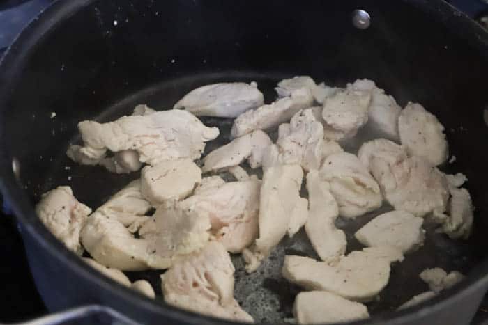 chicken in a skillet cooking