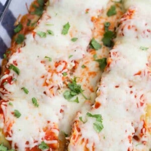 Lasagna Roll Ups in a clear casserole dish