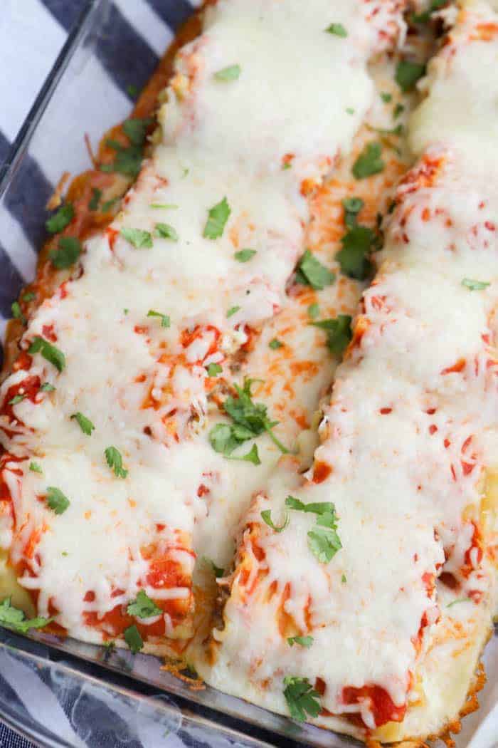 Lasagna Roll Ups in a clear casserole dish