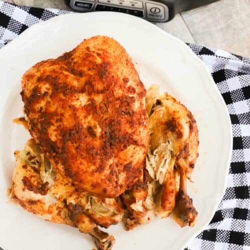 Slow Cooker Whole Chicken on a white plate
