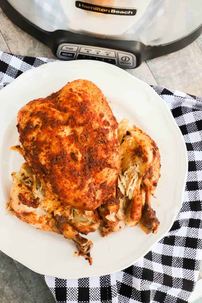 Slow Cooker Whole Chicken on a white plate