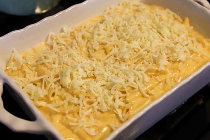 Cheesy Penne Bake in a casserole dish before baking