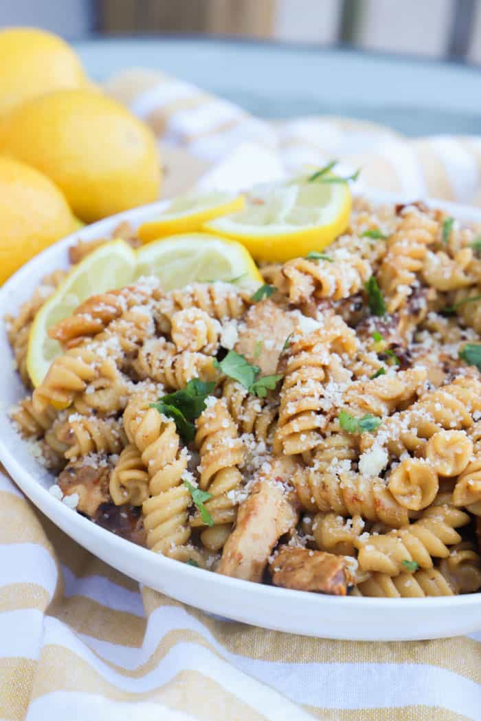 Parmesan Lemon Pasta and Chicken with fresh lemons on top
