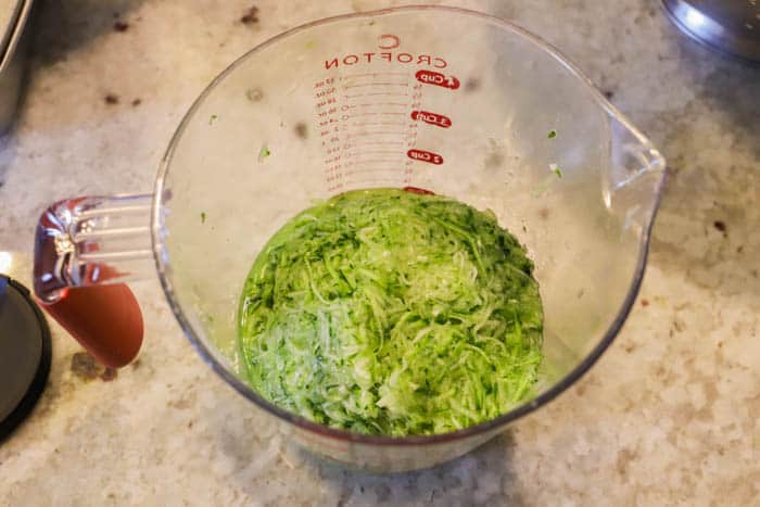 shredded Zucchini in a measuring cup