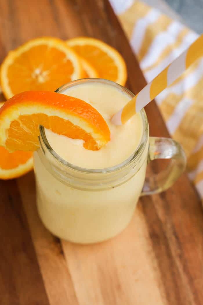 Sunshine Smoothie with orange and white straw 