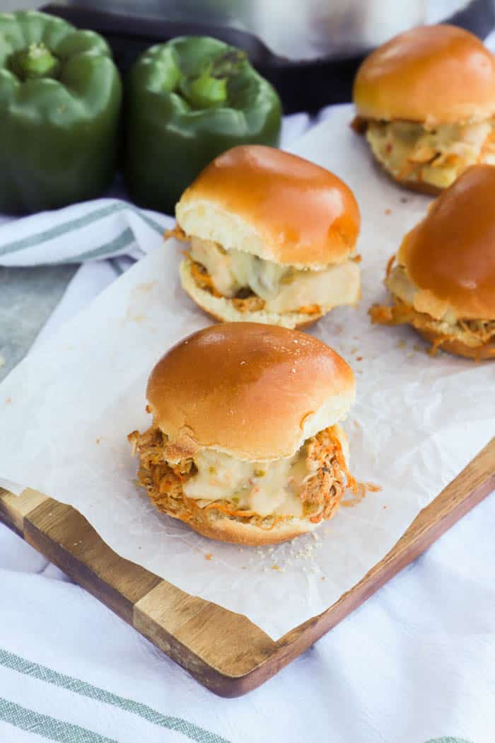 Slow Cooker Chicken Fajita Sliders on a tale with white and green napkin