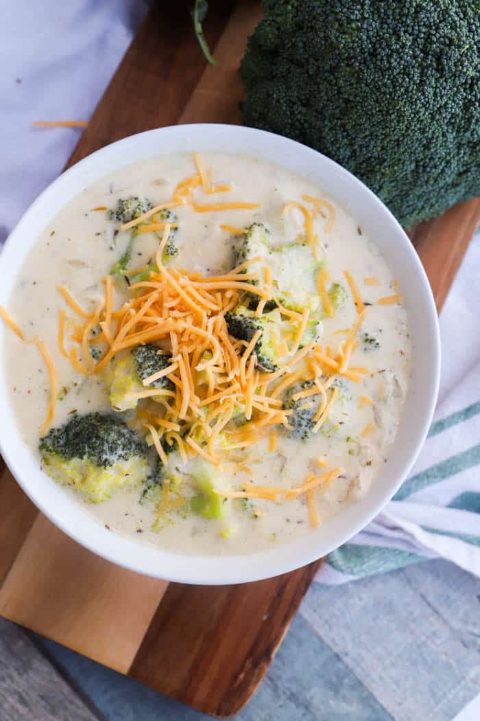 Broccoli Cheese Soup topped with shredded cheese