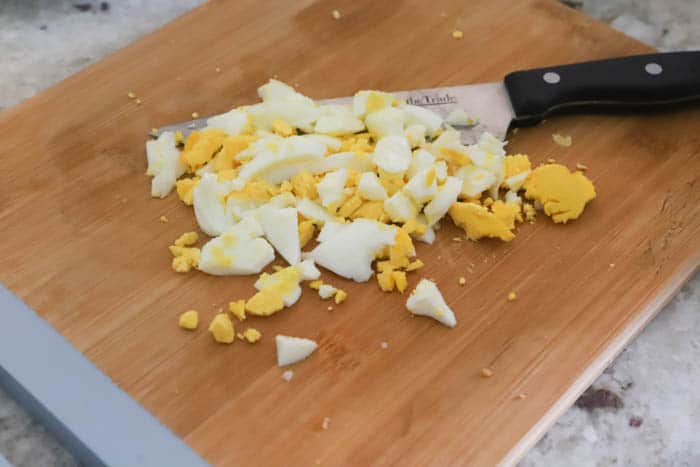 diced egg on a cutting board