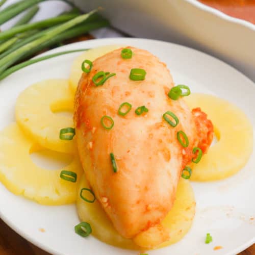 Hula Chicken on a white plate with pineapple