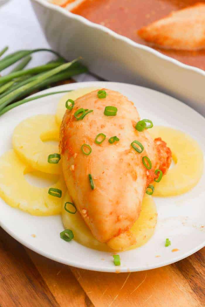 Hula Chicken on a white plate with pineapple