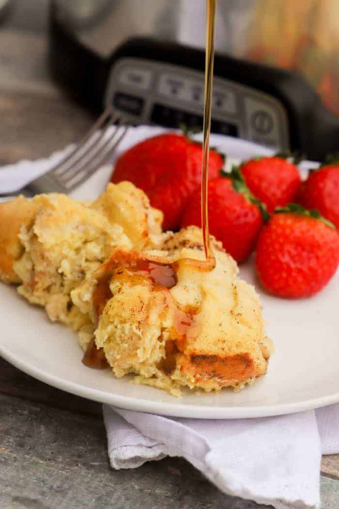 Slow Cooker French Toast Casserole pouring syrup