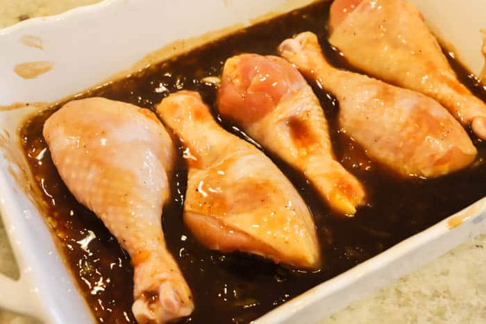 Easy Orange Chicken Drumsticks in homemade sauce ready for the oven