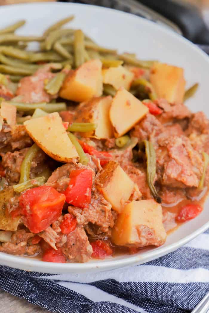 close up picture of Slow Cooker Steak and Potatoes in white bowl 