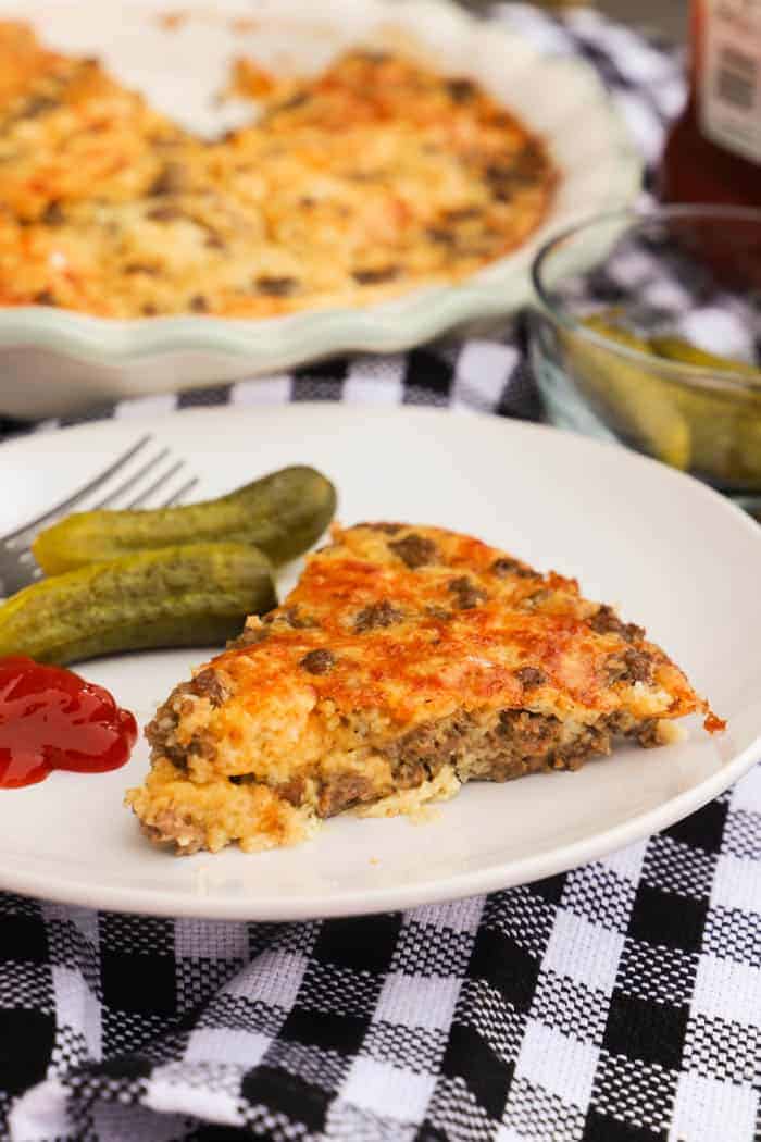 Bacon Cheeseburger Pie on a plate with ketchup.