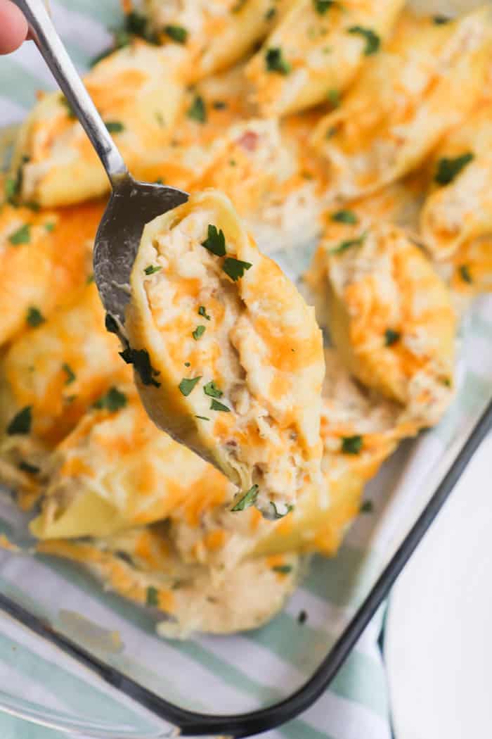 Chicken Bacon Ranch Stuffed Shells on a spoon ready to serve
