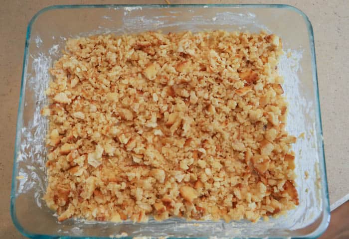 adding cracker topping to Jalapeno Popper Dip