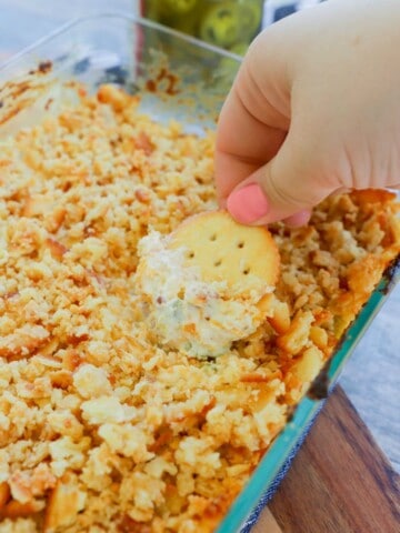 Jalapeno Popper Dip with ritz cracker topping in clear dish