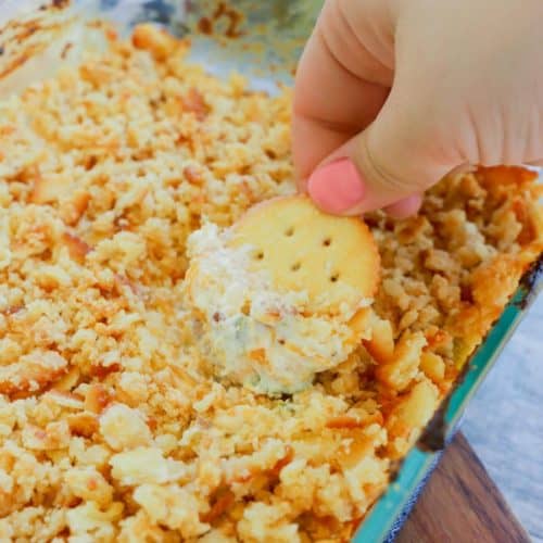 Jalapeno Popper Dip with ritz cracker topping in clear dish