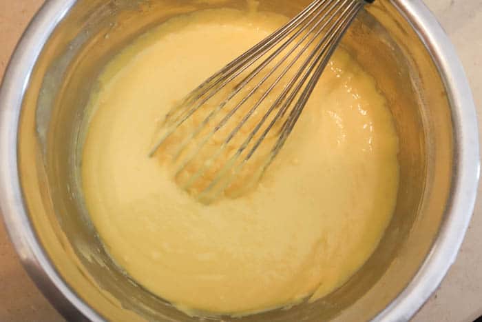 mixing batter with whisk