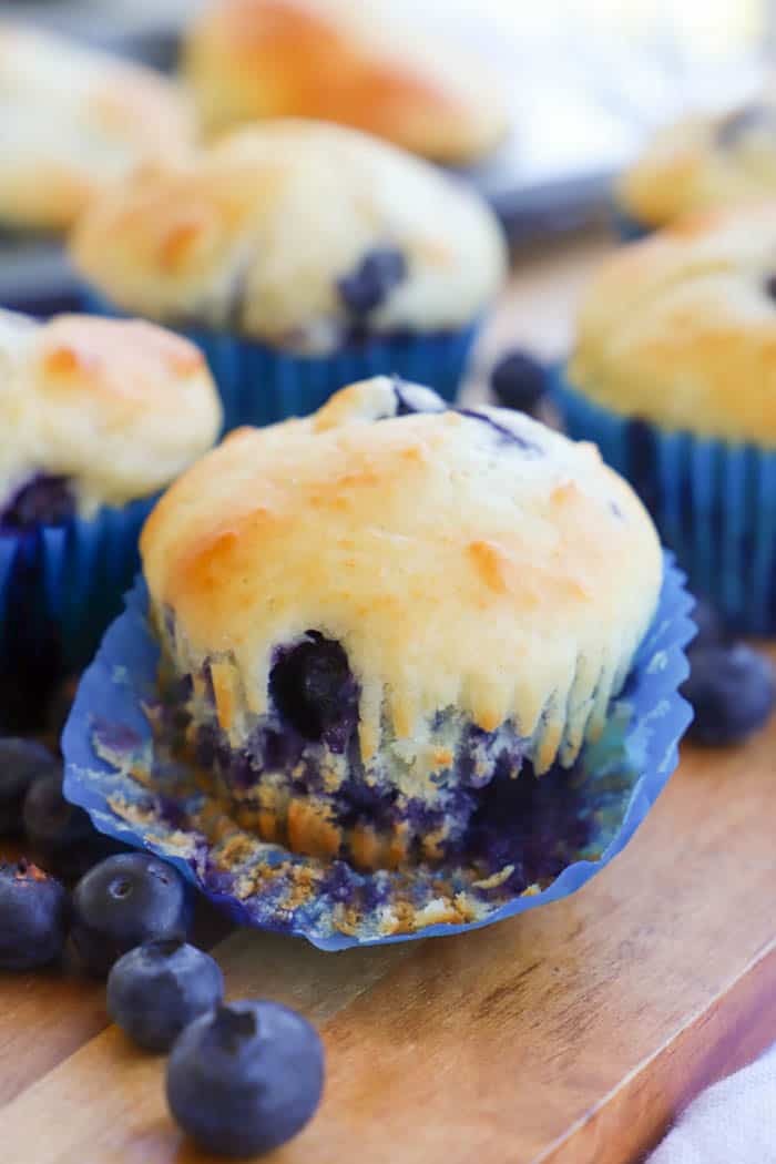 removing cupcake liners from Greek Yogurt Blueberry Muffins