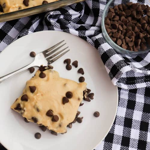 Chocolate Chip Cookie Dough Frosted Brownies on a white plate
