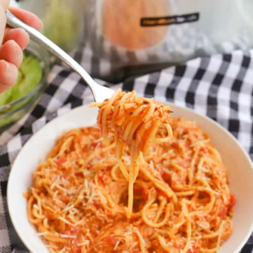 Slow Cooker Creamy Tomato Chicken Spaghetti on a fork