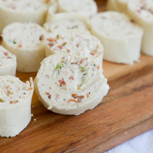Bacon Ranch Pinwheels on a wooden cutting board