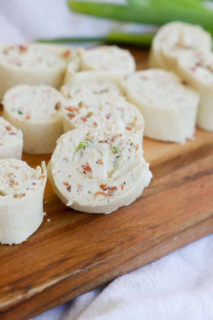 Bacon Ranch Pinwheels on a wooden cutting board