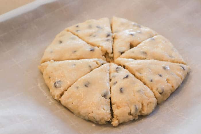 slicing formed Chocolate Chip Scones before baking
