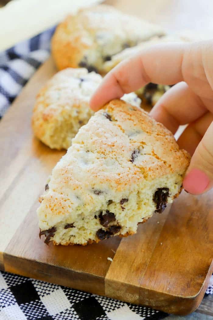 sliced baked Chocolate Chip Scones in hand