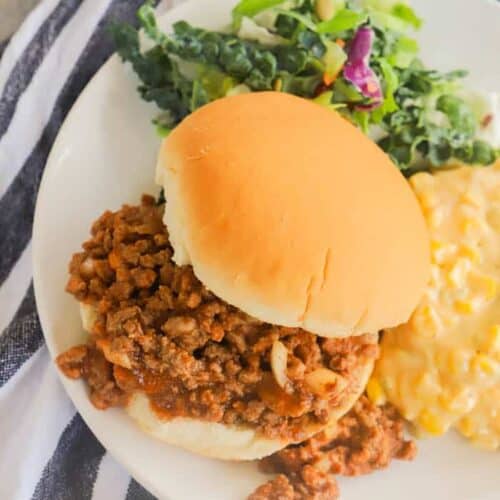 Slow Cooker Sloppy Joes on a plate with salad