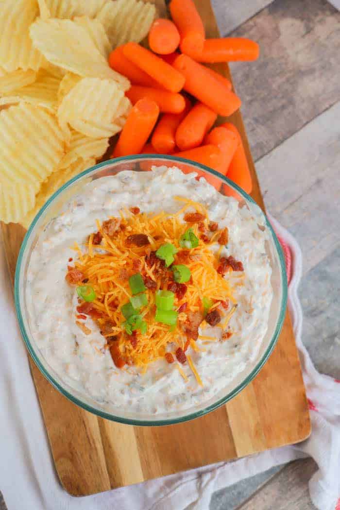 Loaded Ranch Dip in a bowl topped with cheese and bacon