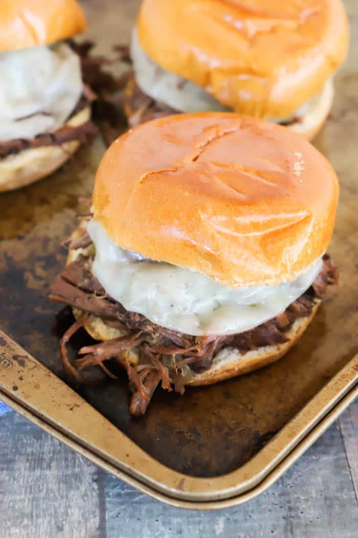 Slow Cooker Shredded Beef Sandwiches on a baking sheet
