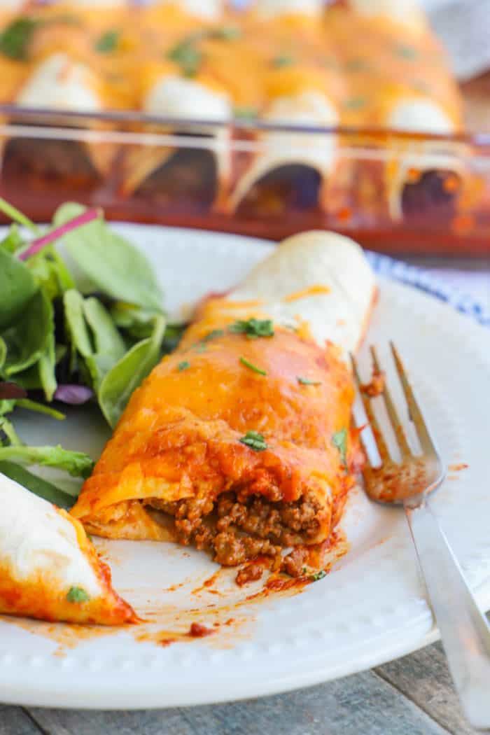 Easy Beef Enchiladas cut open with a fork